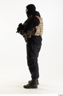 Arthur Fuller Contractor in Mask holding gun standing whole body…